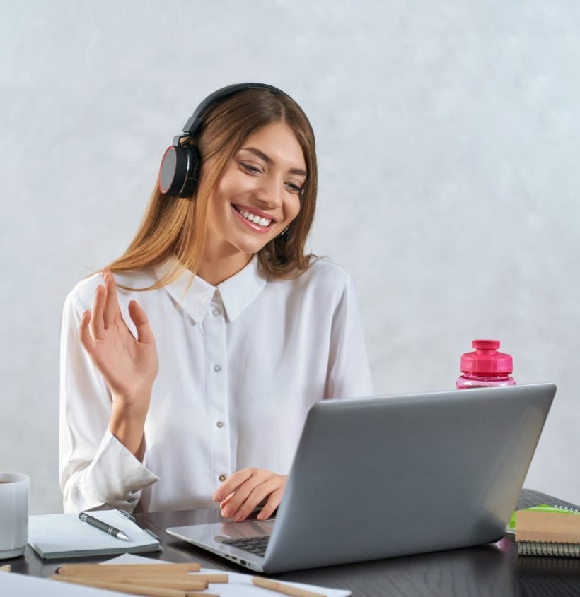 woman-waving-and-talking-during-online-education-on-laptop.jpg digital bolt